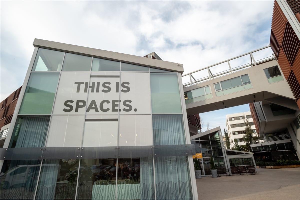 Exterior of the modern white and glass office building at Ag. Konstantinou 59-61, Marousi, Athens.