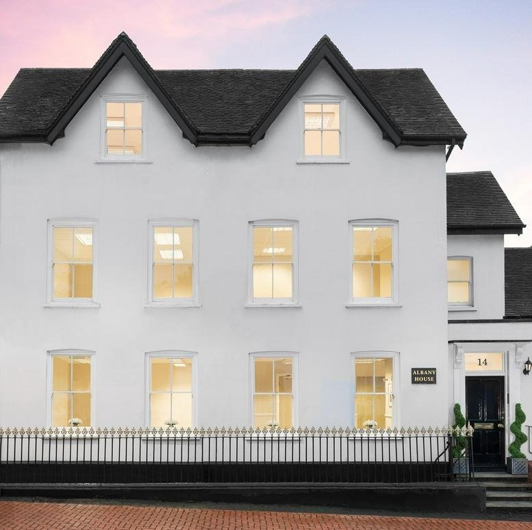 Exterior view of the white facade and gabled roof at Albany House, 14 Shute End, Wokingham, Berkshire.