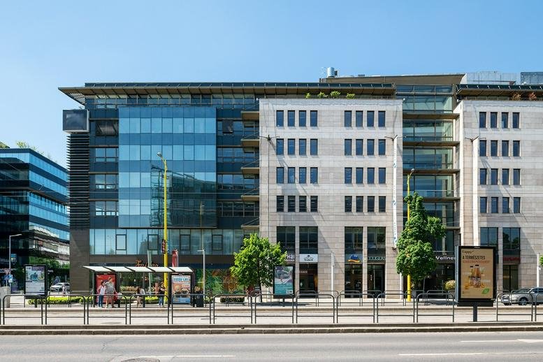 Exterior view of the modern glass and stone building at Alkotás utca 53.