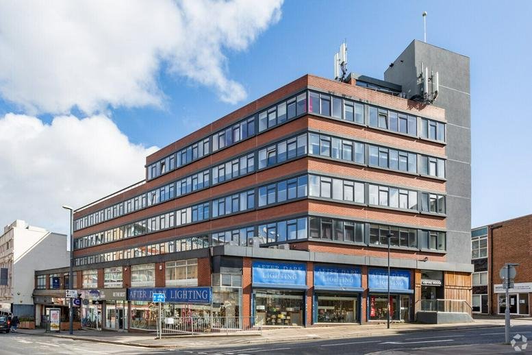 Exterior view of the multi-story brick and glass facade of Aspire House on Sitwell Street.