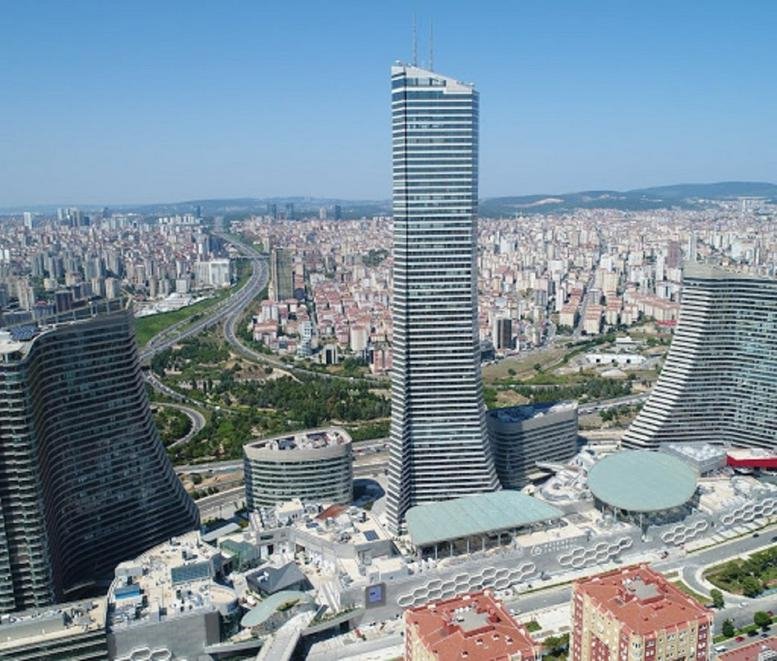 Aerial exterior view of the tall glass skyscraper at Metropol İstanbul Sitesi Ataşehir.