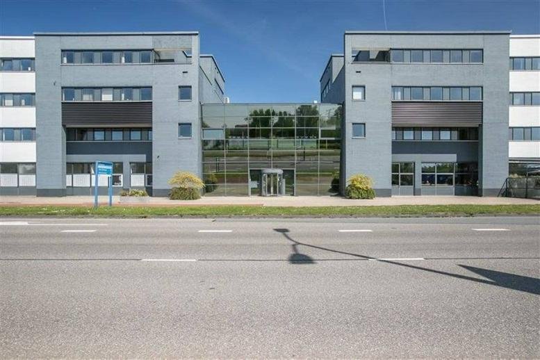 Exterior view of the modern grey and glass office building at Atoomweg 63, Utrecht.