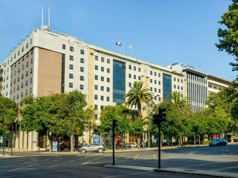Exterior view of the classic stone facade building at Avenida da Liberdade 245, 4º A, Lisbon.