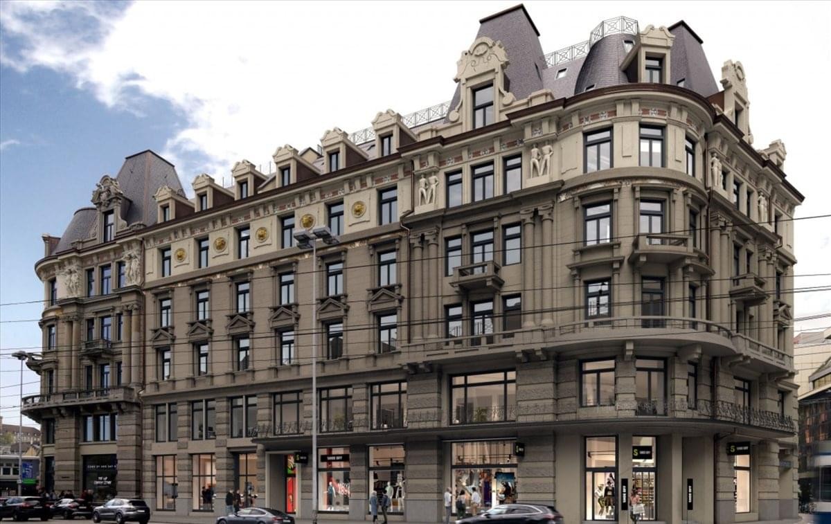 Exterior view of the historic grand stone building at Bahnhofplatz 2, Zurich, Switzerland.