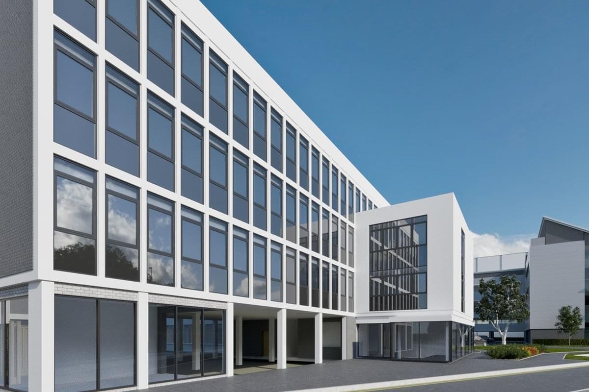 Exterior view of the white modern facade at Barnwood Point Business Park, Corinium Avenue.