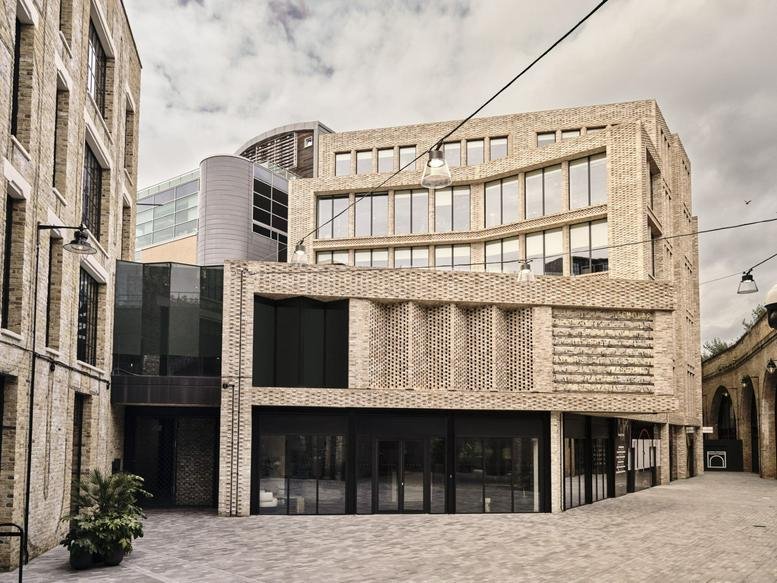 Exterior view of the multi-level brick facade at Borough Yards, 19 Dirty Lane.