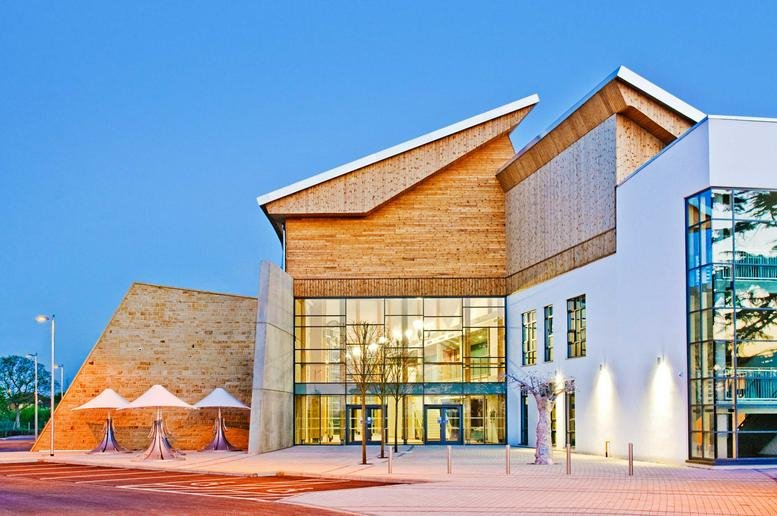 Exterior of the modern wooden and glass building at Brunel Way, The Bridge, Dartford, Kent.