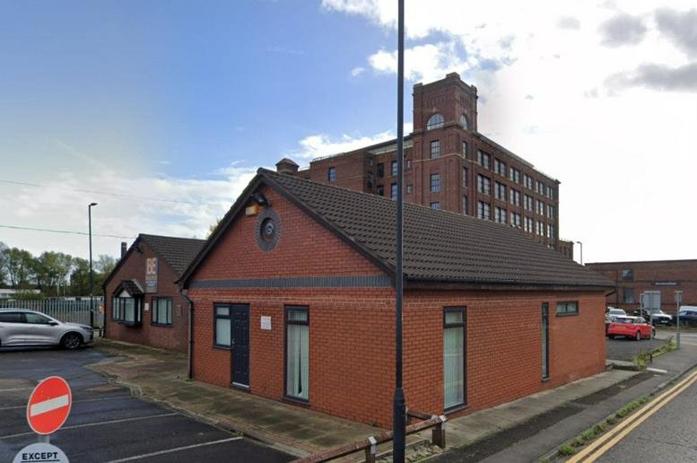 Exterior view of the red brick building at Brunswick Street, Leigh, Lancashire.