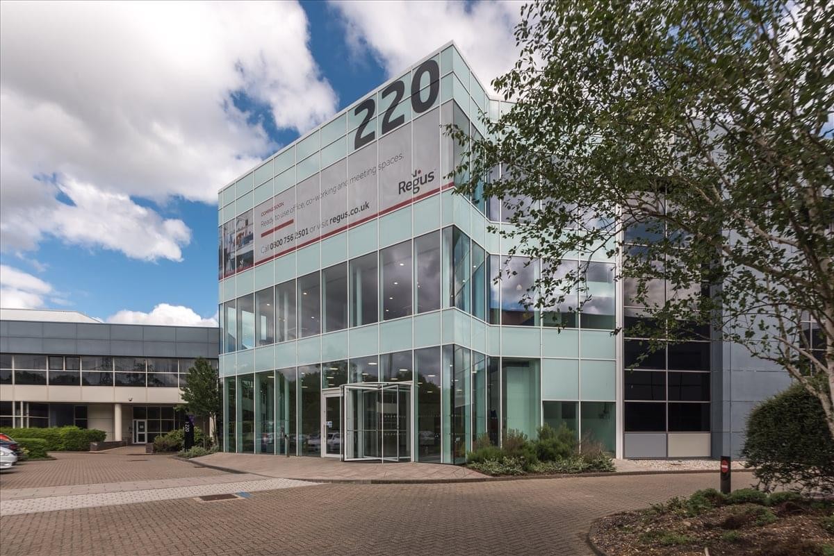 Exterior view of Building 220, Wharfedale Road, Wokingham with its glass facade and numbered signage.
