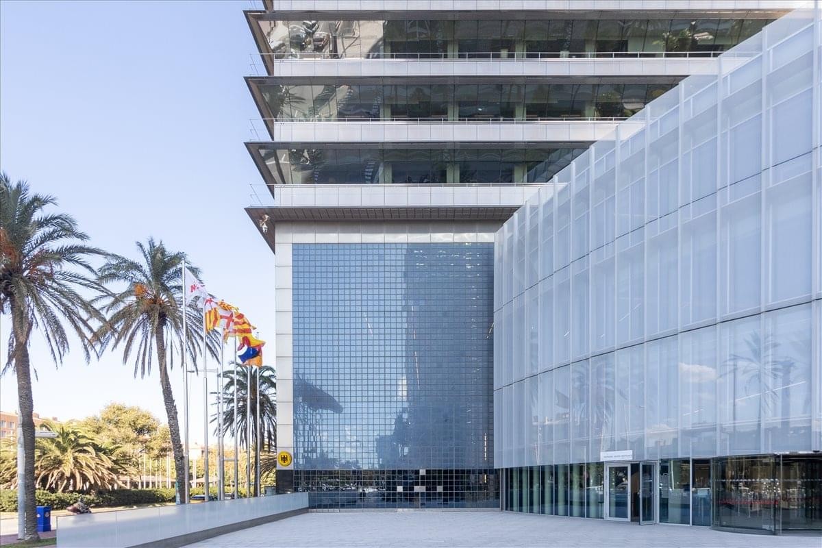 Exterior view of the contemporary glass and steel facade at C/ Marina 16-18.