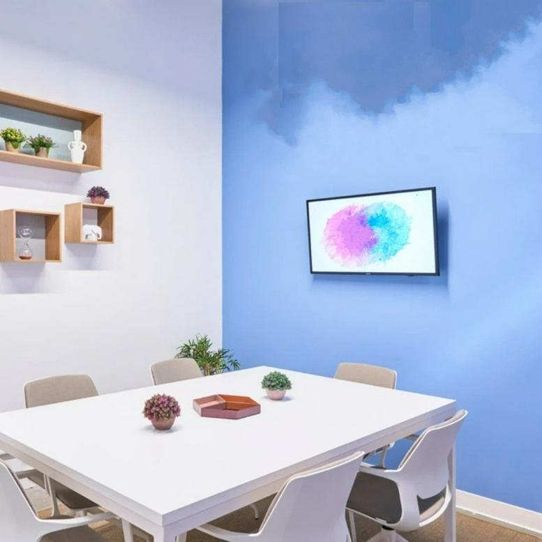 Modern meeting space at Calle de Vandergoten, 1, Tapices, Madrid with a blue cloud-mural wall.