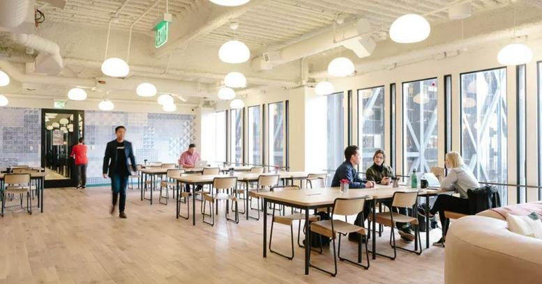 Spacious communal dining area at Calle Eloy Gonzalo, 27, 28010 Madrid, Spain with wooden floors and ample natural light.