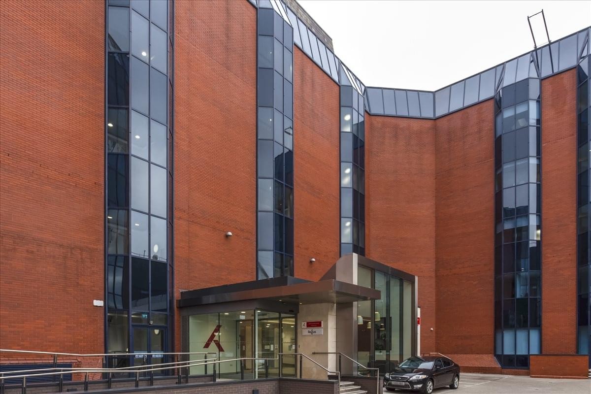 Red brick and glass facade of the office building at Calthorpe Road, Edgbaston, Birmingham.