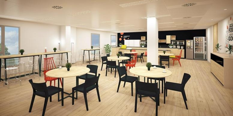 Spacious communal dining area at Carrer Ramón Turró 169 featuring round tables and colorful chairs.