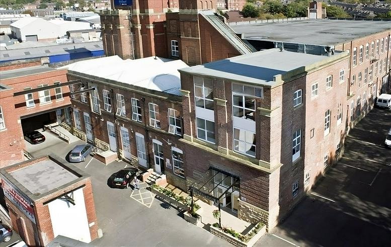 Aerial view of the red brick industrial facade of Progress House.