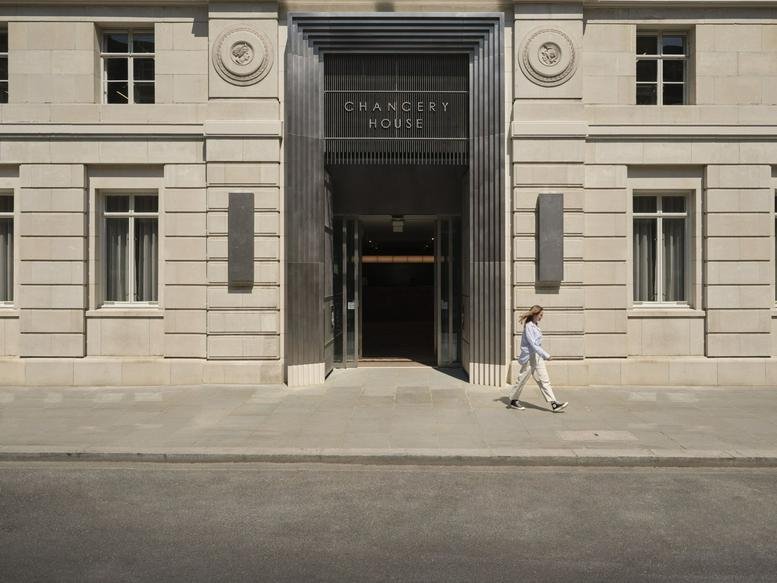 Exterior stone facade and grand entrance of Chancery House, Chancery Lane, London.