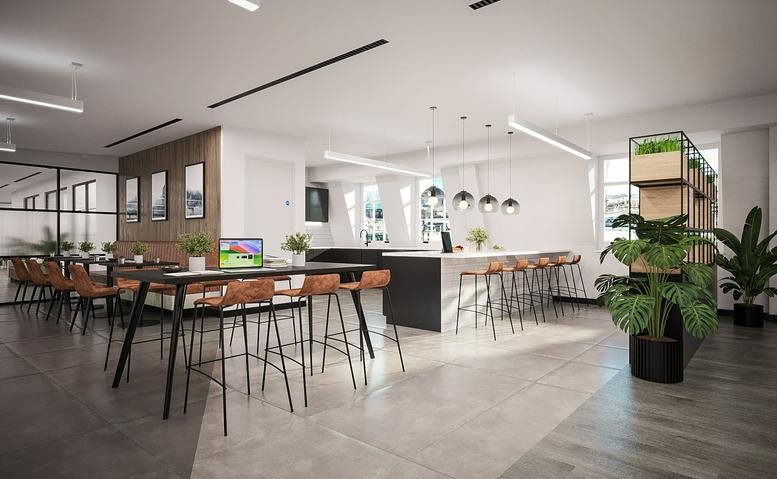 Spacious communal breakout area at Chancery Lane, 11 Staple Inn, Staple Court featuring a cafe bar and leafy plants.