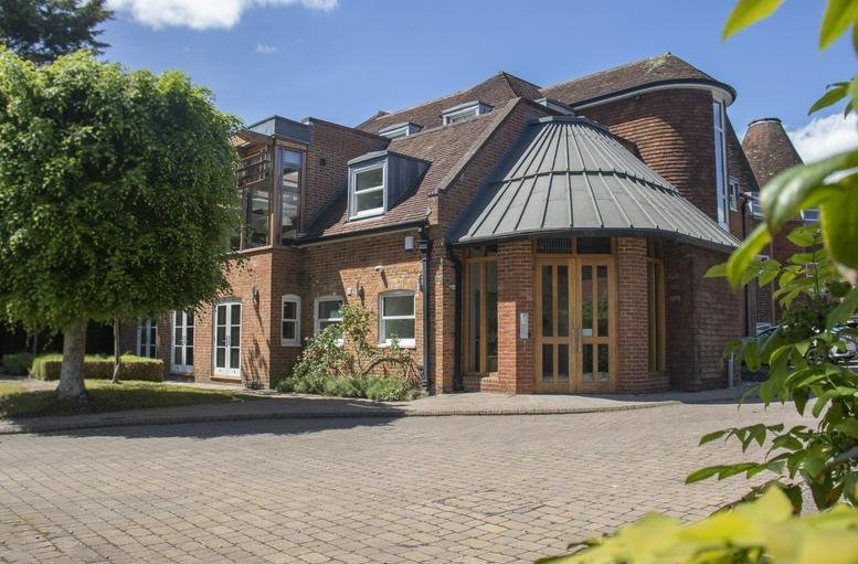 Exterior view of the brick facade and circular entrance at Cheyenne House, West Street.