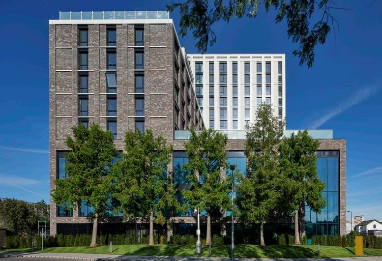 Exterior view of the multi-story brick and glass facade of Chiswick Works.