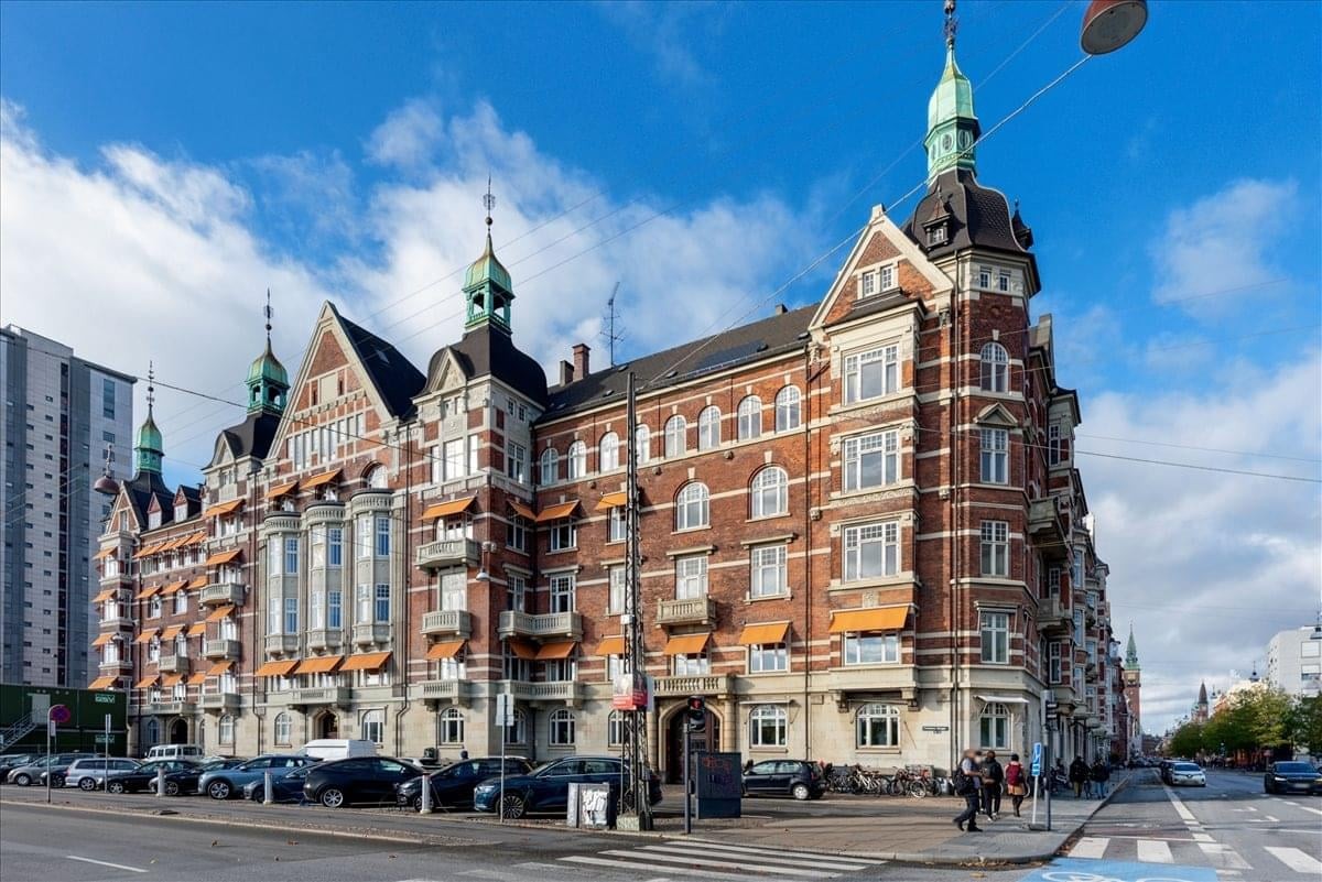Exterior view of the historic red brick building at Christians Brygge 28, Copenhagen.