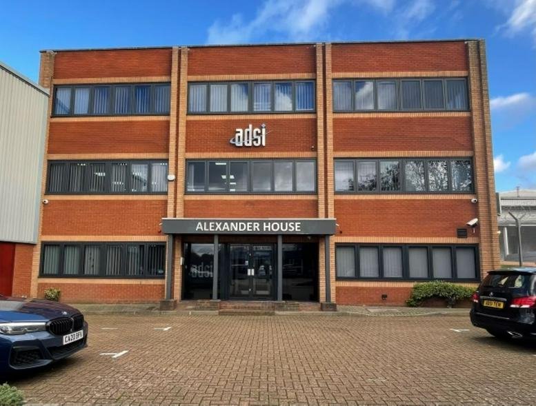 Exterior view of the three-story brick building known as Alexander House.