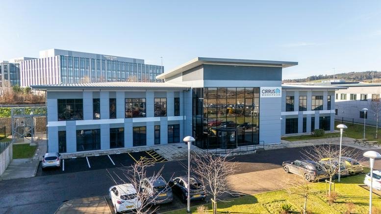 Exterior view of the contemporary Cirrus Building, ABZ Business Park facade with ample parking.