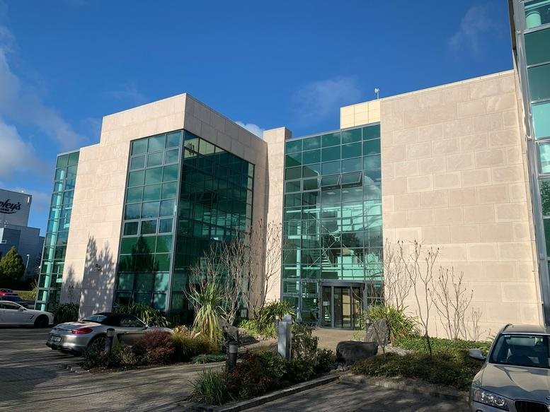 Exterior view of the modern glass and stone facade at City Junction Business Park.