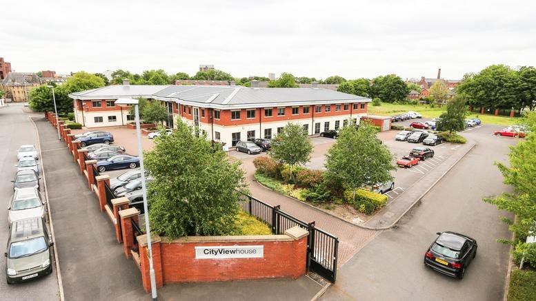 Exterior view of the brick facade and parking at City View House, 5 Union Street.