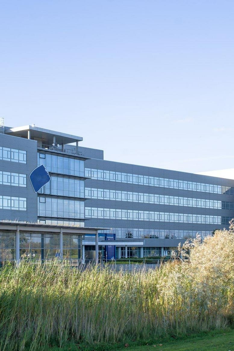 Exterior view of the modern glass and grey Cobalt Business Exchange building.