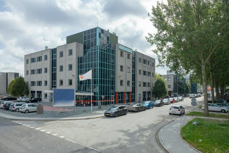 Exterior view of the modern glass and stone facade at Corkstraat 46, Business Center Noord West.