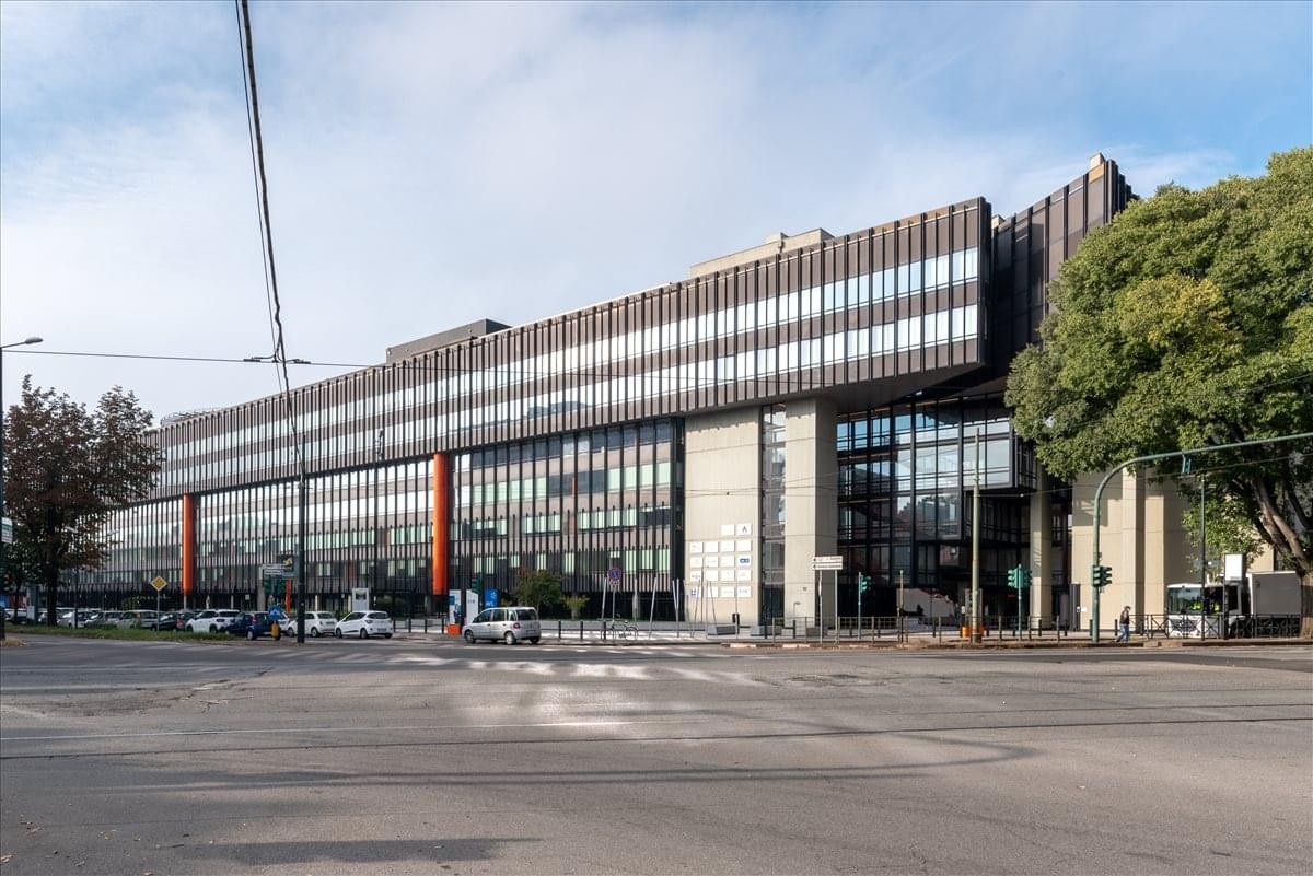 Modern exterior of the office building at Corso Francesco Ferrucci 112 with a distinctive tiered facade.