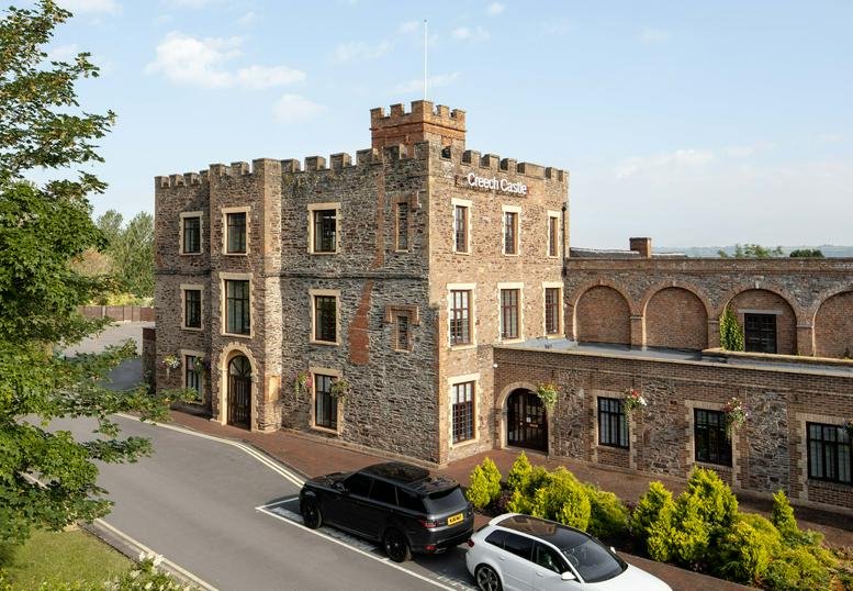 Exterior view of the historic stone facade of Creech Castle Business Centre.