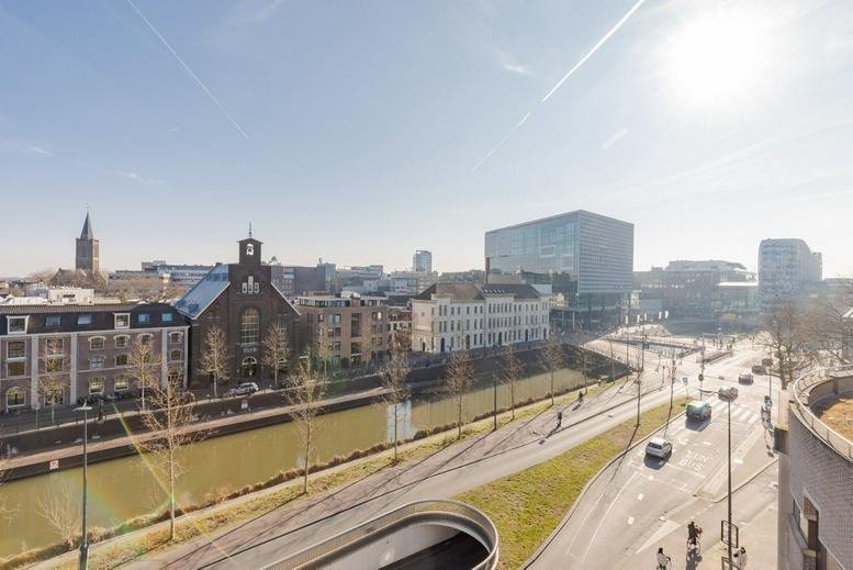 Elevated exterior view of Daalsesingel 51, Utrecht, overlooking a canal and city architecture.