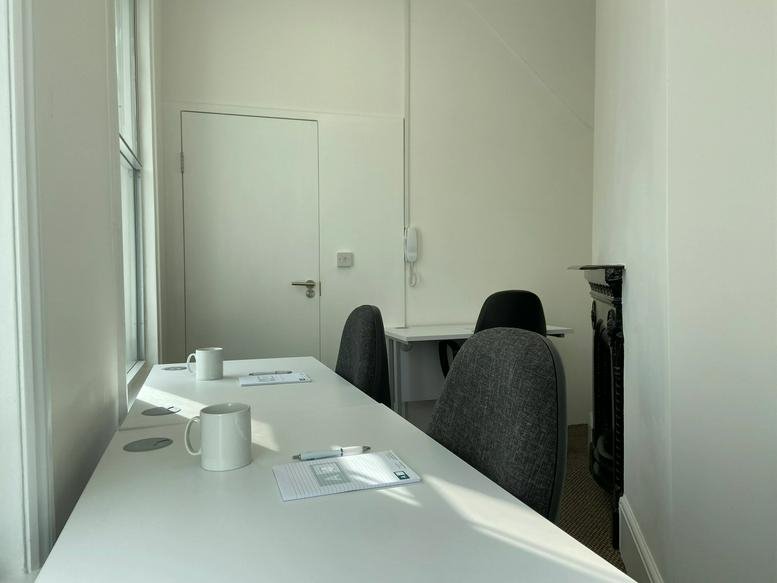 Bright office space at De Montfort House, 101 King's Cross Road with white desks and natural light.