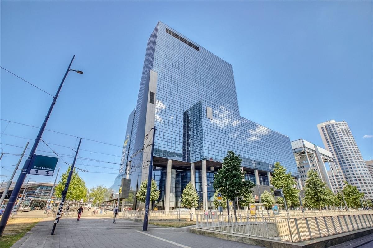 Exterior view of the blue glass skyscraper at Delftse Poort.