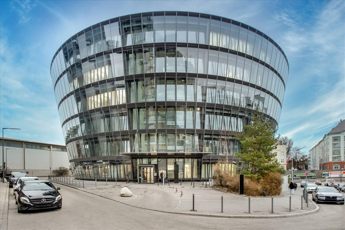 Exterior view of the curved glass facade at Dingolfinger Strasse 15, Munich, Bavaria.
