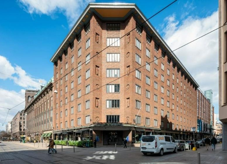 Exterior view of the red brick corner building at Epicenter Helsinki Mikonkatu 9.