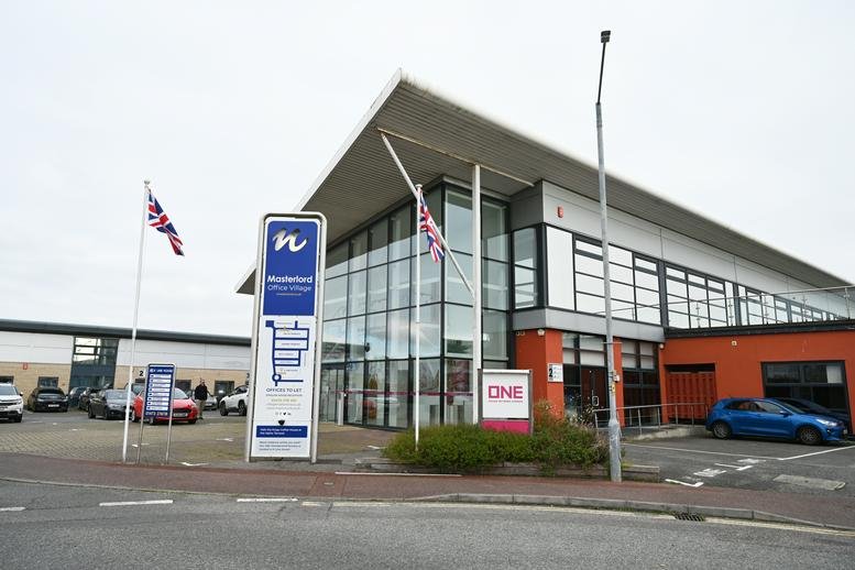Exterior of the modern glass-fronted Epsilon House office building.
