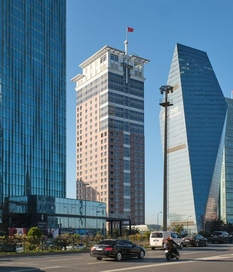 Exterior view of the modern glass and stone Tekfen Tower.