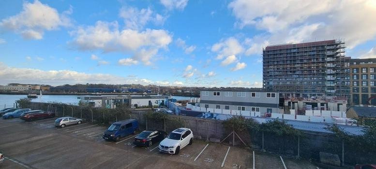 Exterior view of Fairways House, Mount Pleasant Road, Southampton with a large parking area and modern building.