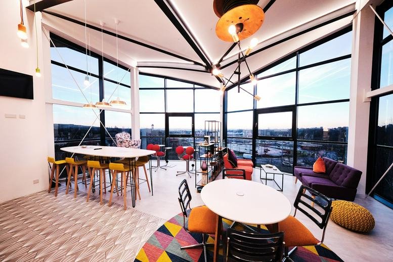 Spacious communal breakout area at Falcon Point, Park Plaza, Cannock with large windows and vibrant furniture.