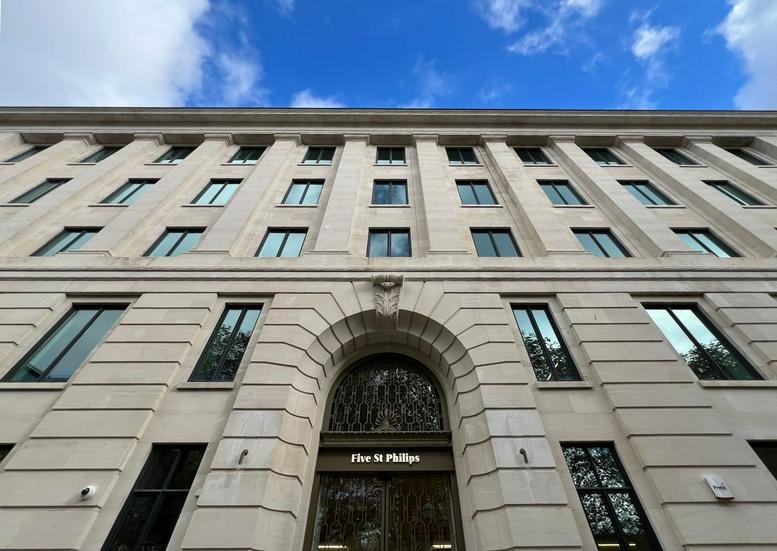 Exterior view of the Five St Philips Place building with blue sky.