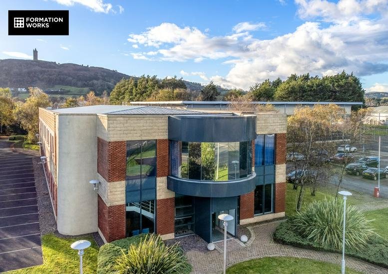 Exterior of the modern Formation Works, 4 Jubilee Road, Newtownards building with unique circular glass facade.
