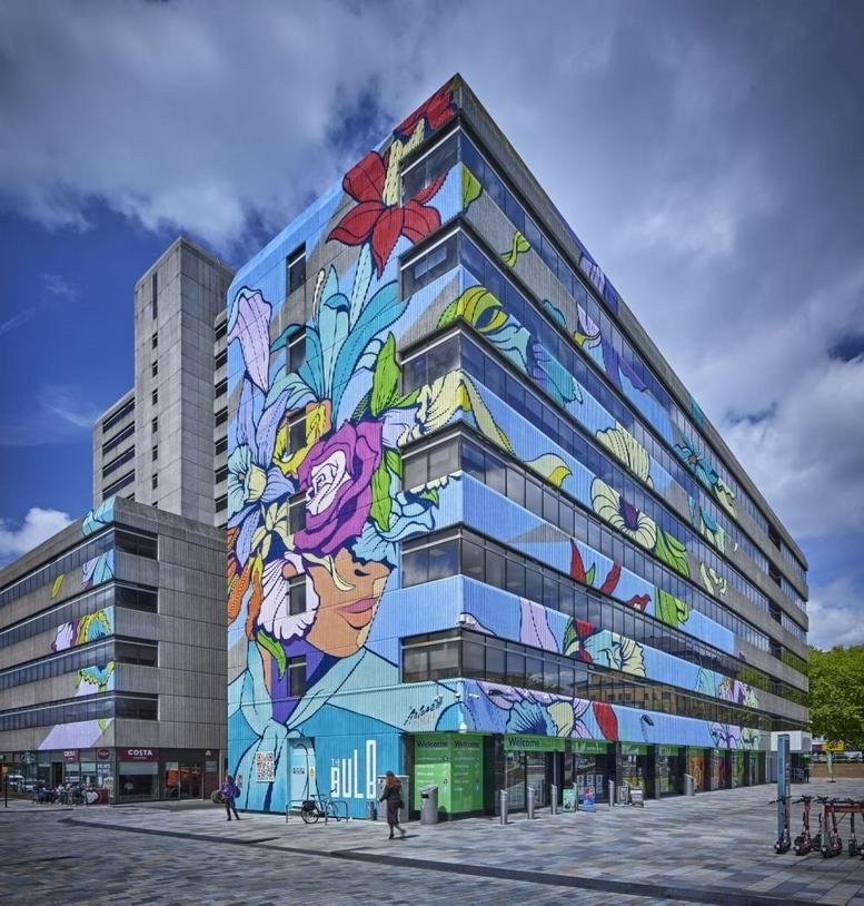Exterior of Frobisher House at Nelson Gate featuring a vibrant floral mural across the building facade.
