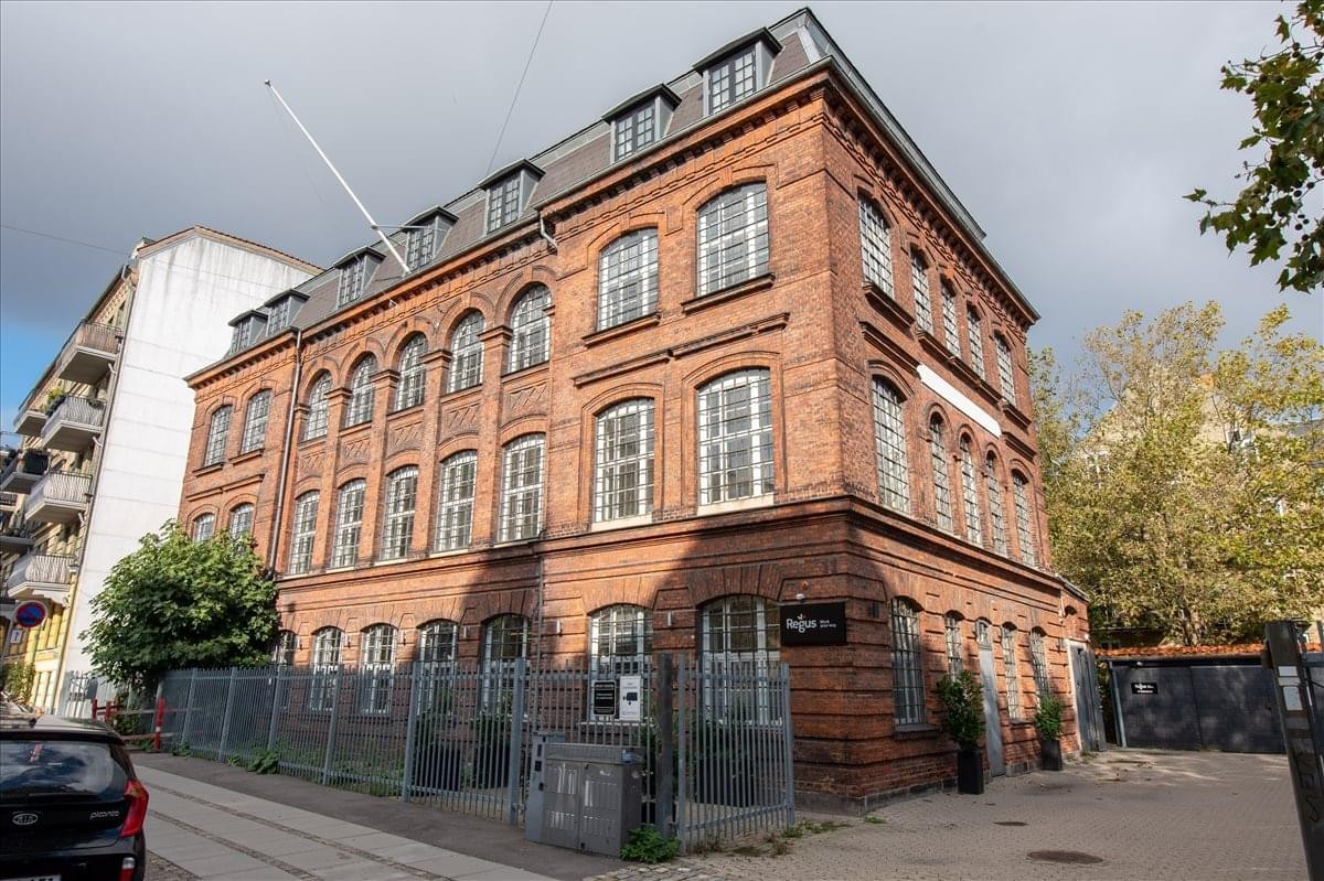 Exterior view of the red brick industrial-style building at Fuglevangsvej 11-13, Frederiksberg.