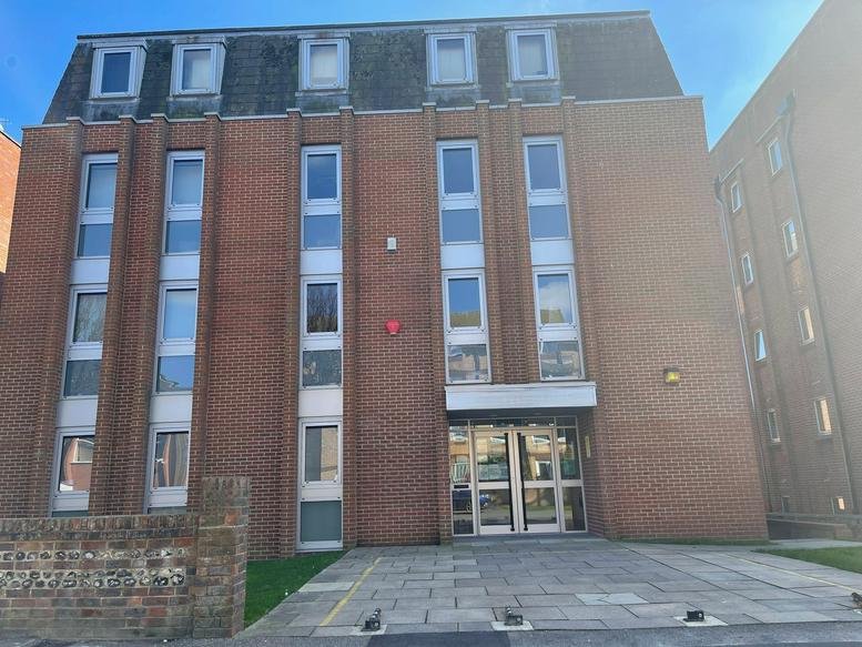 Exterior view of the brick facade at Greencoat House, 32 St Leonard’s Road, Eastbourne.