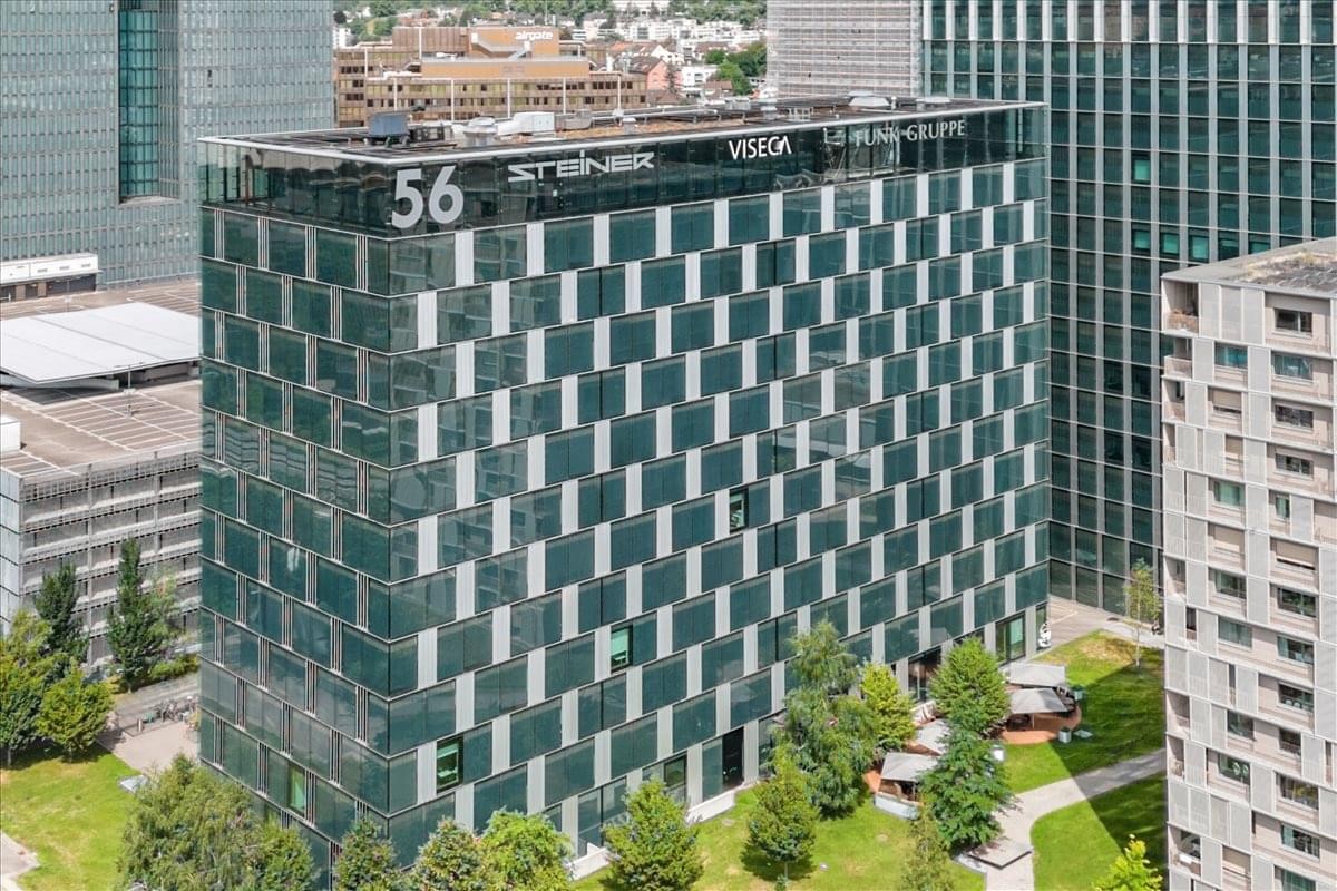 Exterior view of the modern glass-facade Hagenholzstrasse 56, Andreaspark, Zurich building.