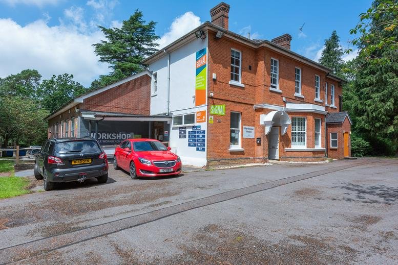 Exterior view of the brick facade and entrance at Hampshire Road, Bordon.