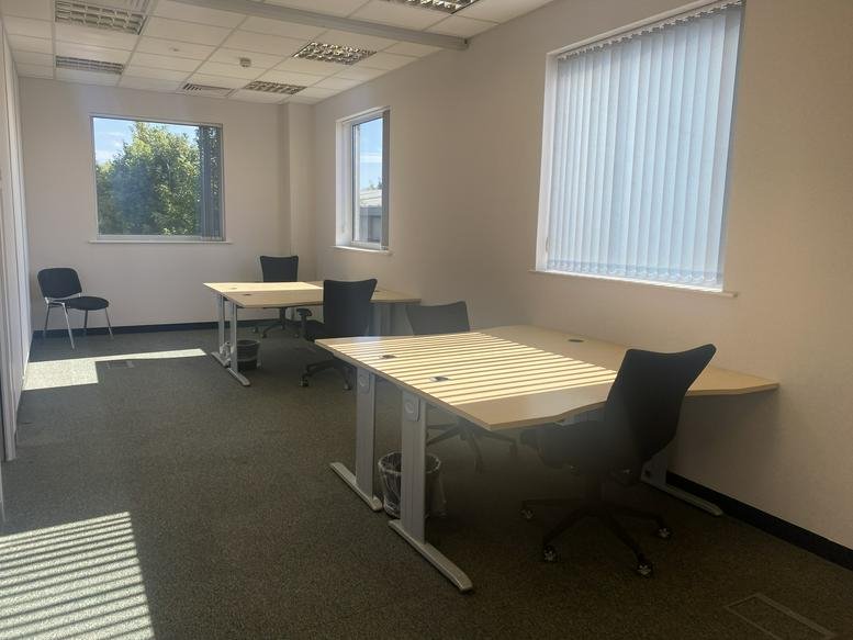 Open-plan office space at Hawkins Road, Hythe, Colchester, Essex with multiple desks and natural light.