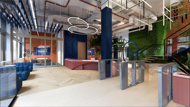 Modern lobby area at Heidestraße 34 featuring a sleek reception desk, green living wall, and spiral light fixtures.